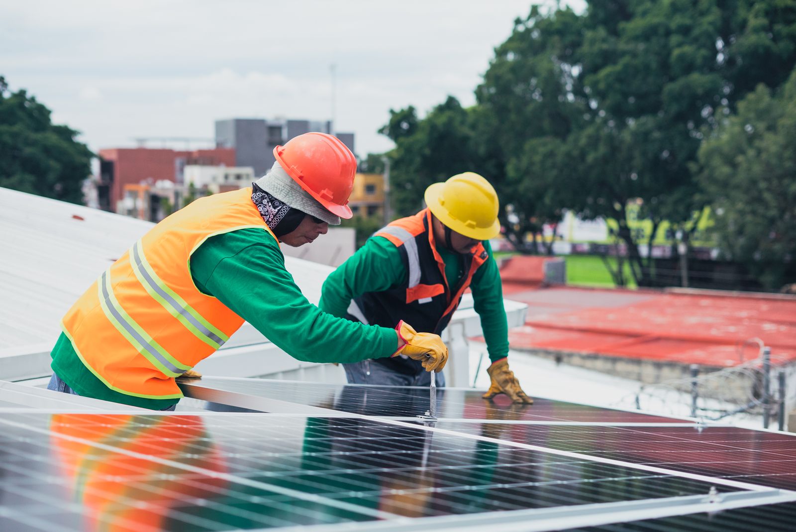 UgoTech in-house technicians installing solar panels on site